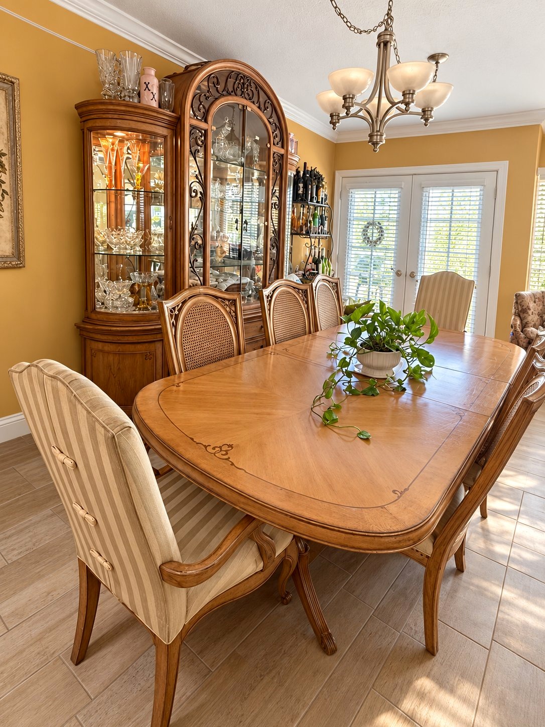 Dining table, cane-back chairs and china cabinets at the Ironwood estate sale